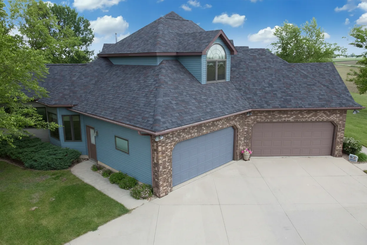 Blue house with Charcoal roof using Vista Black Oak